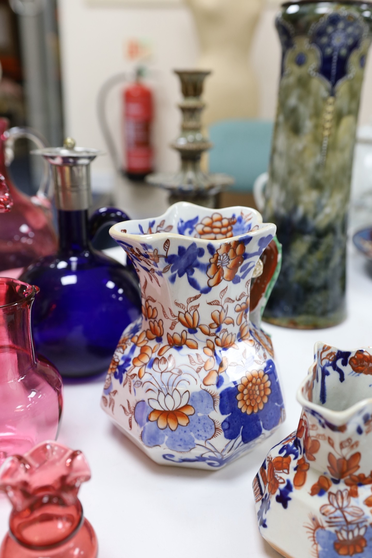 An assortment of cranberry glassware, graduated Masons Ironstone jugs, Chinese export plates etc.